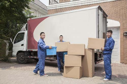 Man With Van Earls Court pricing page illustration showing a moving van and packed boxes