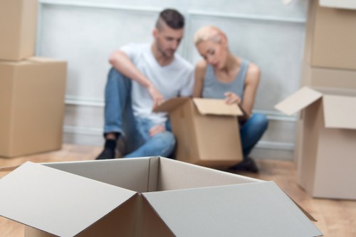 Professional movers planning a furniture removal route in Earls Court
