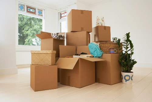 Professional office movers handling equipment and desks in West London