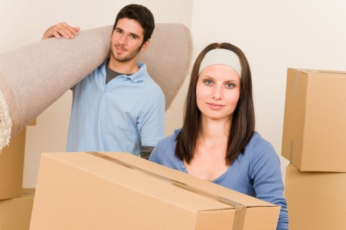 Packed business equipment and furniture ready for a move in Earls Court