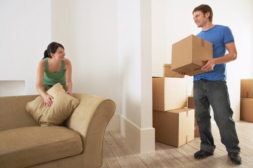 Careful loading of household items into a removals van